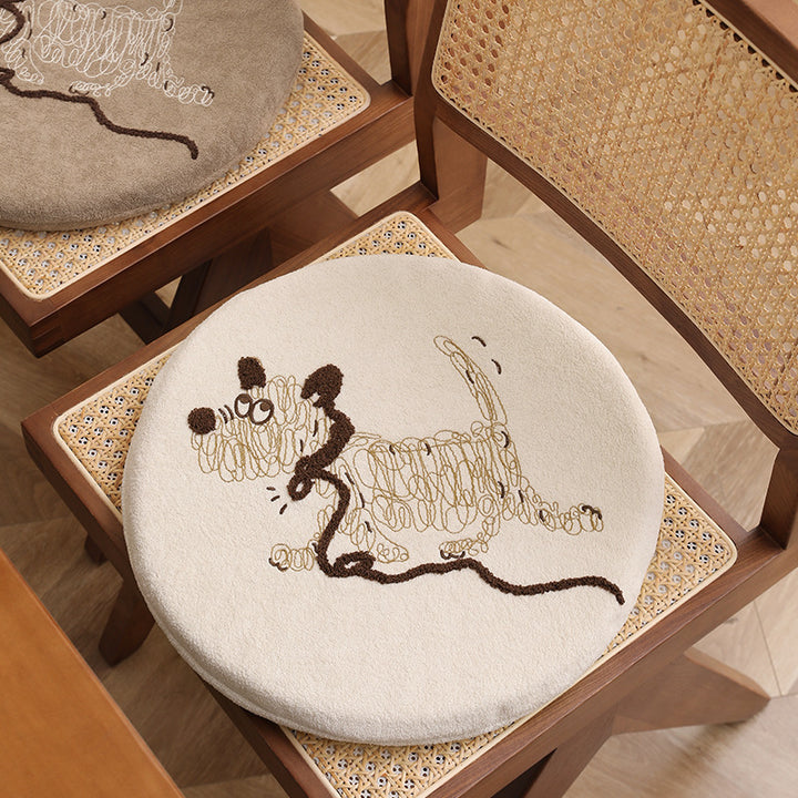 Round padded seat cushion with embroidered cat motif