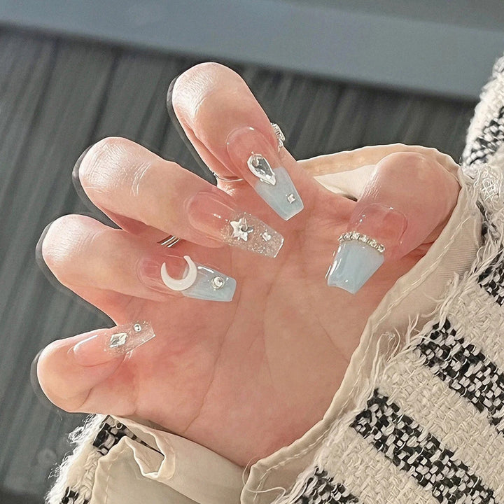 Glamorous artificial nails with delicate flower and glitter effects Kalsten