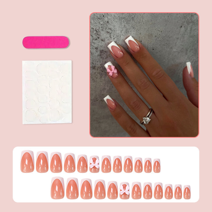 Acrylic nail set with elegant tips and playful bows Kalsten