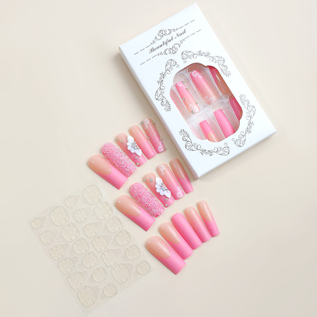 Acrylic nail set with sparkling glitter and delicate flower decorations Kalsten