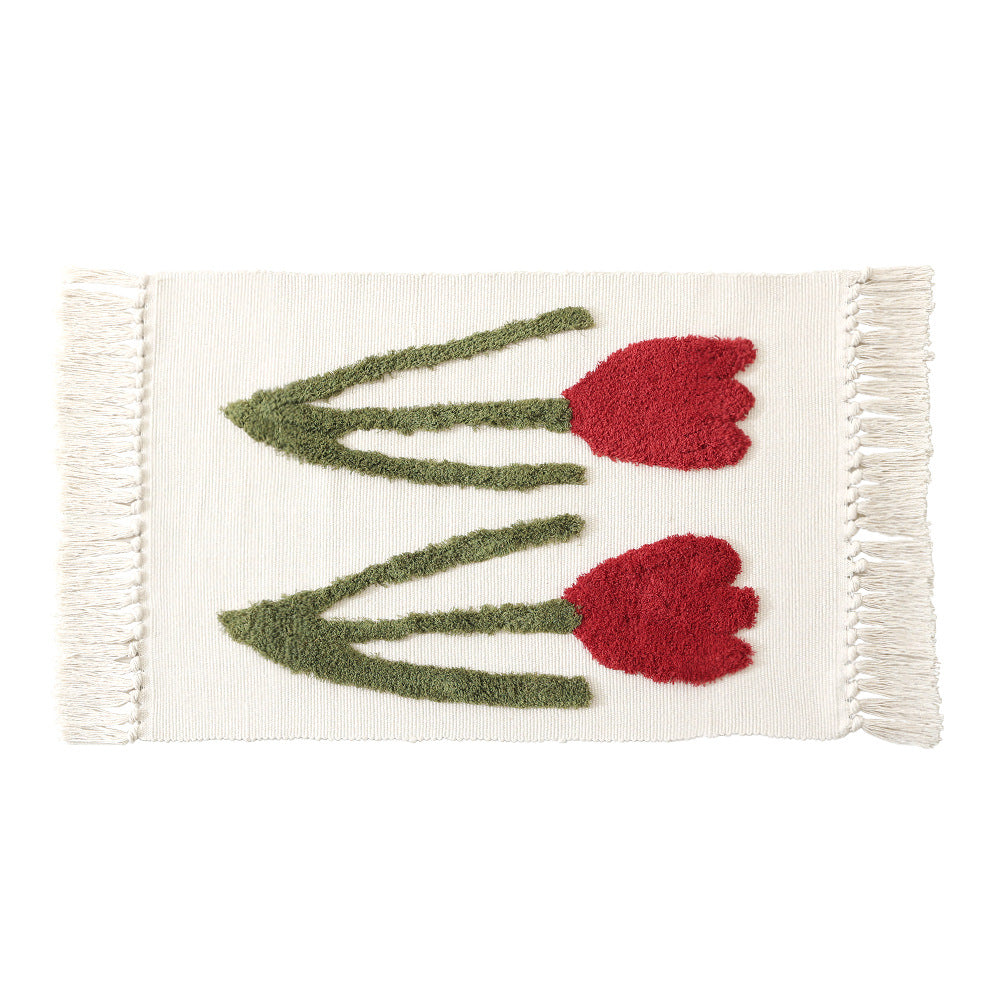 Handwoven cotton bath mat rug with tufted flower appliqué and tassels Kalsten