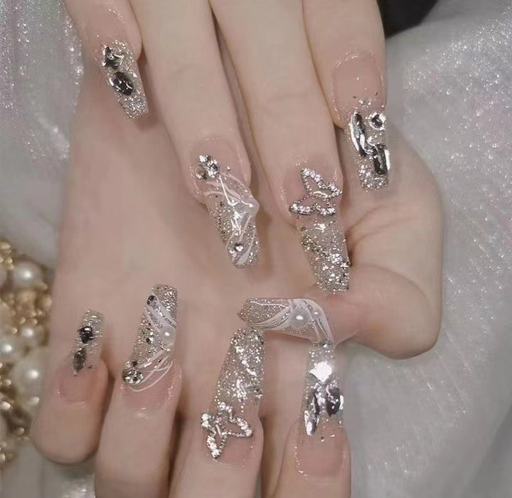 Artistic Nail Art with Glitter and Flower Applications Kalsten