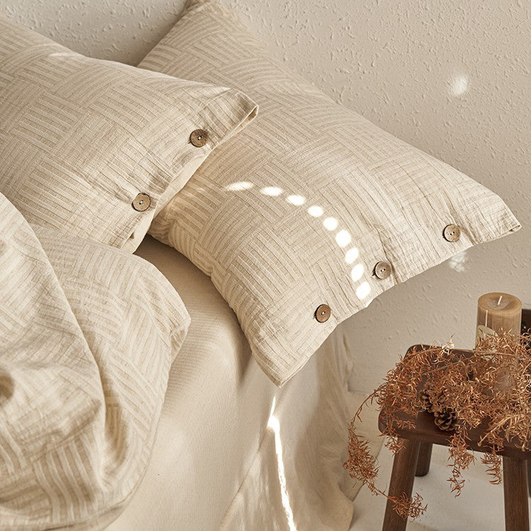 Linen-look bedding set with natural wood button closure and fine texture