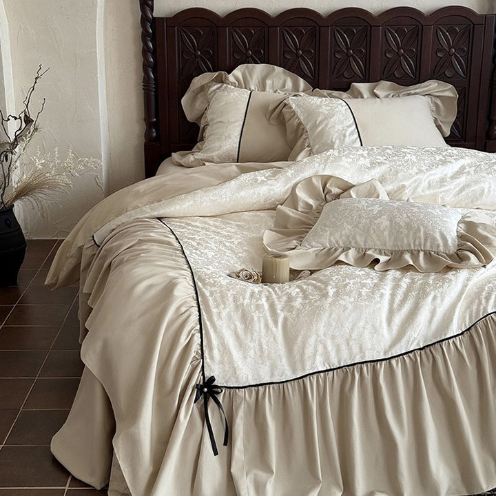 Jacquard bedding set with ruffle, decorative ribbons and fine piping