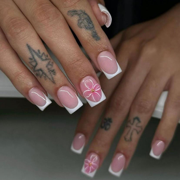 Artistic nail art with delicate flowers and elegant French lace Kalsten