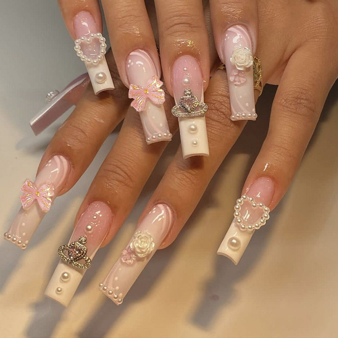 Artful nail tips with pearl and bow motifs Kalsten