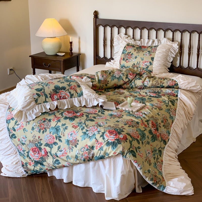 Romantic bedding set with ruffles, floral inserts and decorative pillowcase