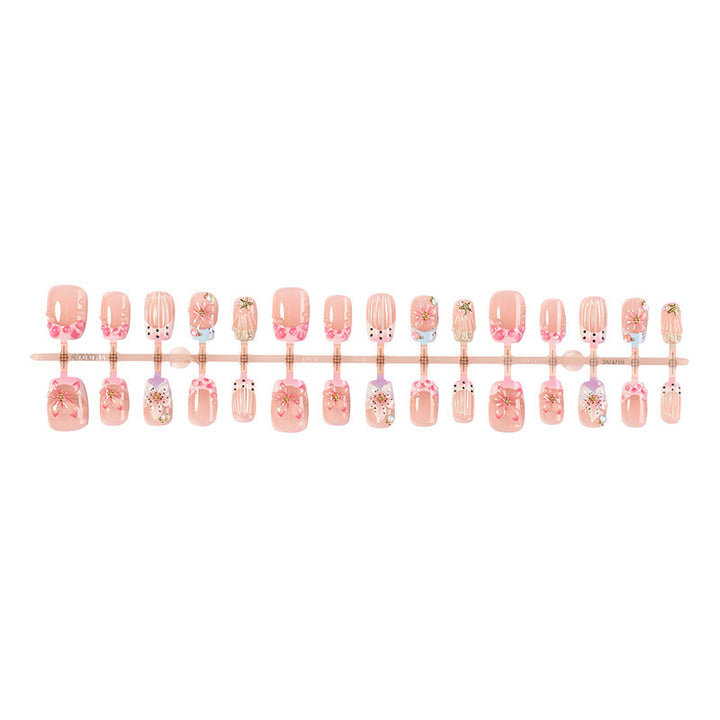 Artificial nail set with floral accents and glamorous decorations Kalsten