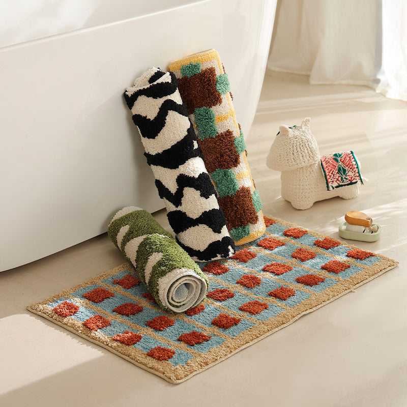 Hand-tufted bathroom bath mat with non-slip backing and textured square relief Kalsten