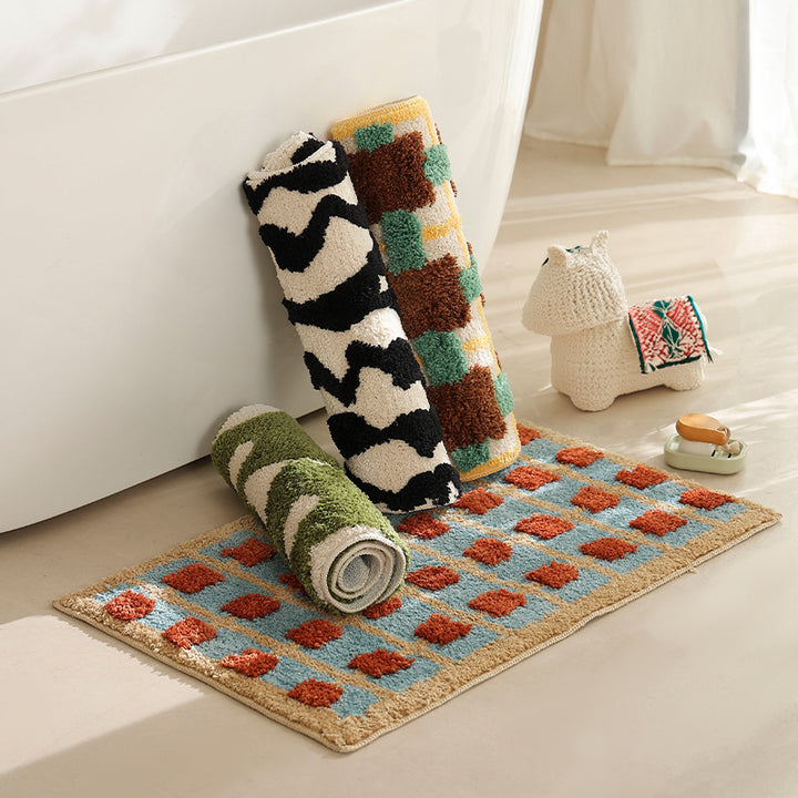 Hand-tufted bathroom bath mat with non-slip backing and textured square relief Kalsten