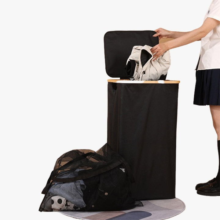 Elegant laundry container with practical lid and carrying system Kalsten