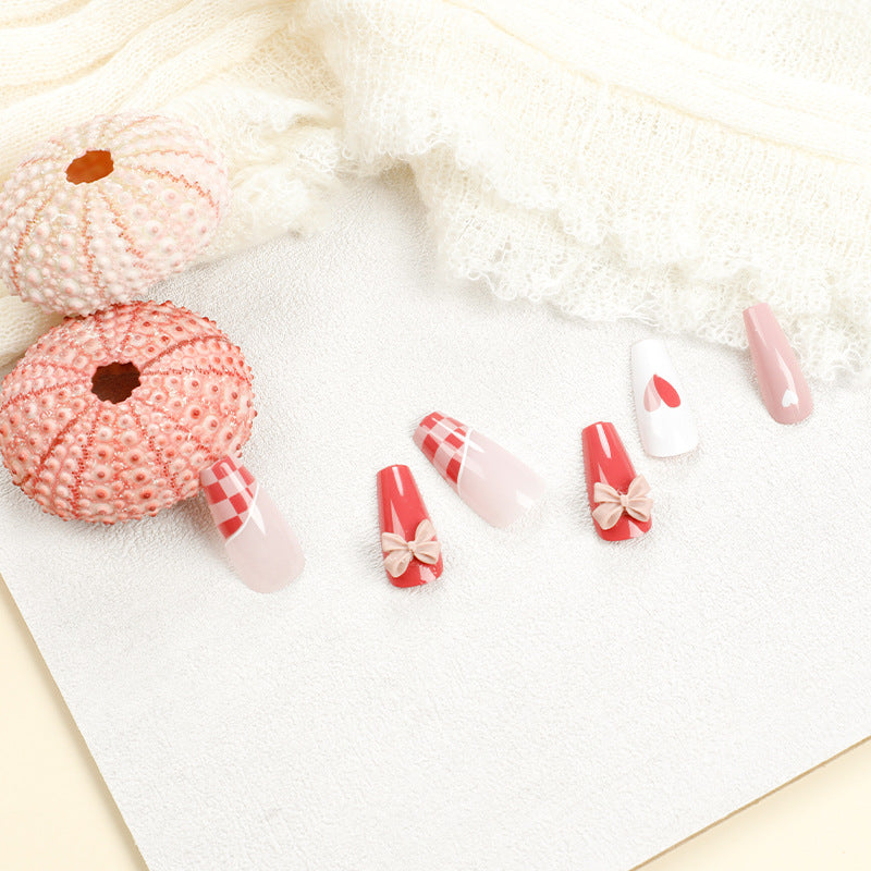 Artful nail extensions with playful designs and romantic accents Kalsten