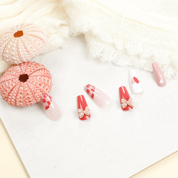 Artful nail extensions with playful designs and romantic accents Kalsten