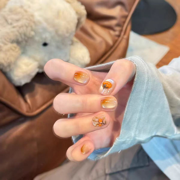 Artificial nails with elegant ombre effect and floral accents Kalsten