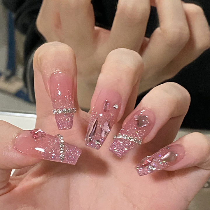 Artificial nails with heart design and glitter accents Kalsten