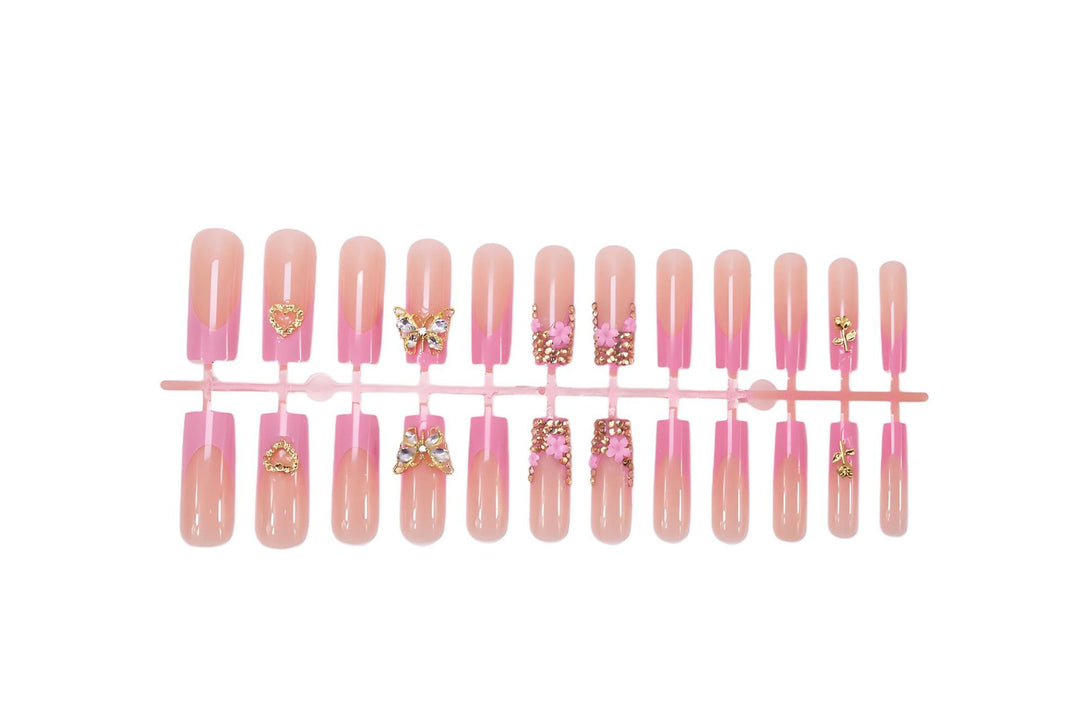Artificial nail extension with glamorous embellishments Kalsten