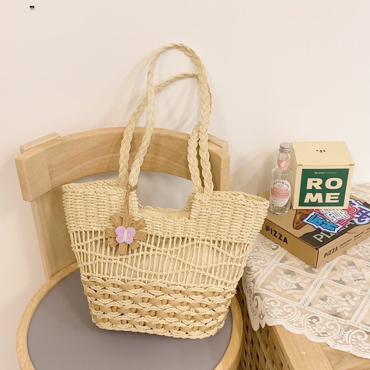 Handwoven beach bag with floral accents Kalsten