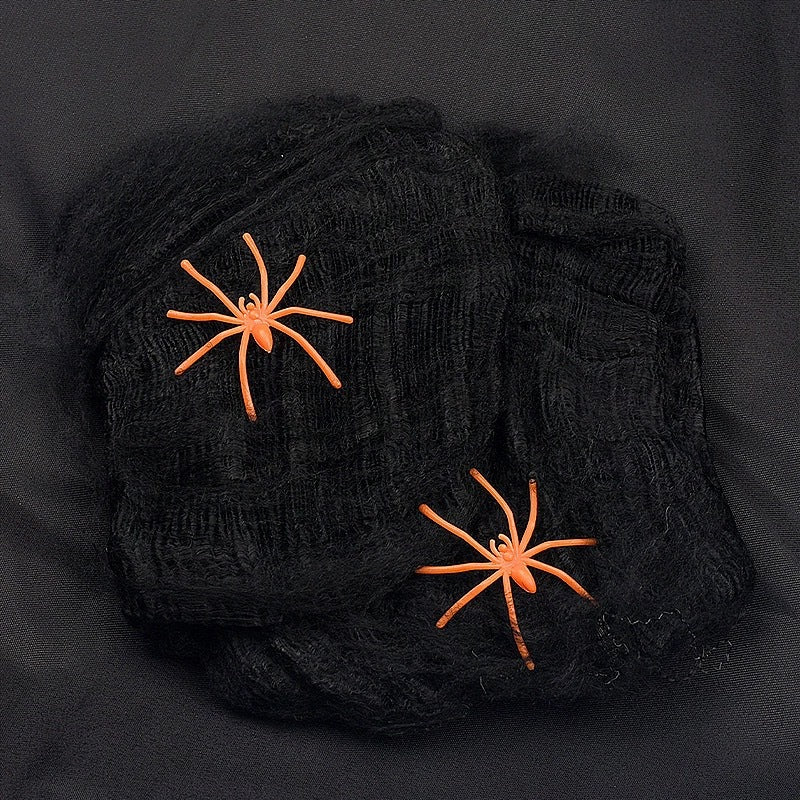 Decorative Halloween spider web with artificial spiders