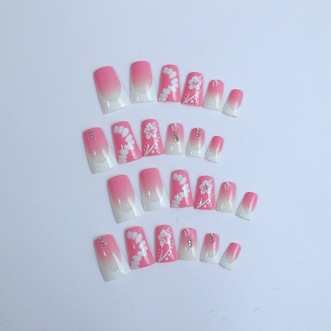 Acrylic nail set with elegant floral designs and glitter accents Kalsten