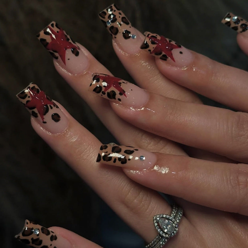 Acrylic nail set with exciting leopard pattern and glamorous accents Kalsten