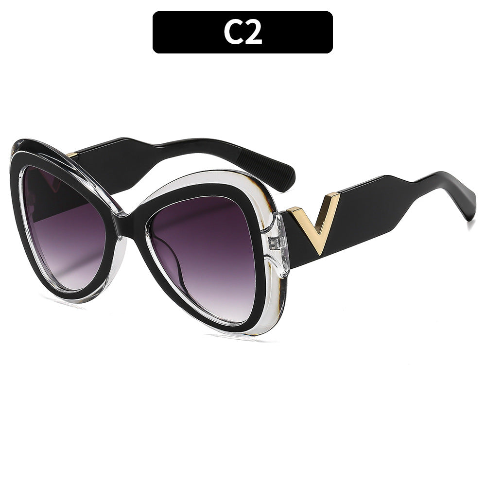Elegant Cat-Eye Sunglasses with Decorative Temple Design