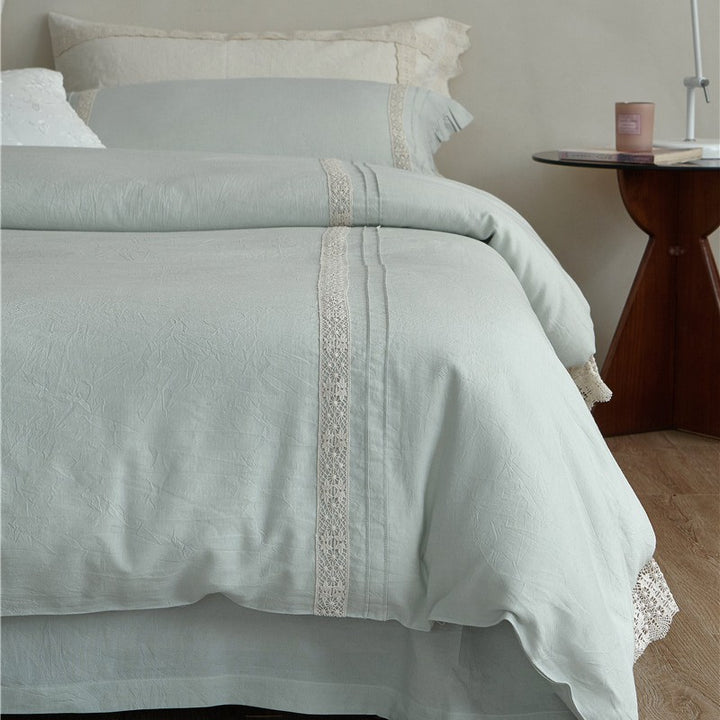 High-quality linen bedding set with handcrafted crochet lace, box pleats, and integrated bed skirt