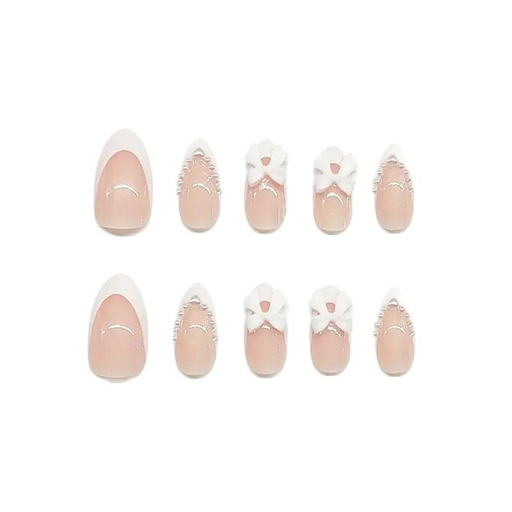 Artistic Press-On Nail Design with Bow Accents Kalsten