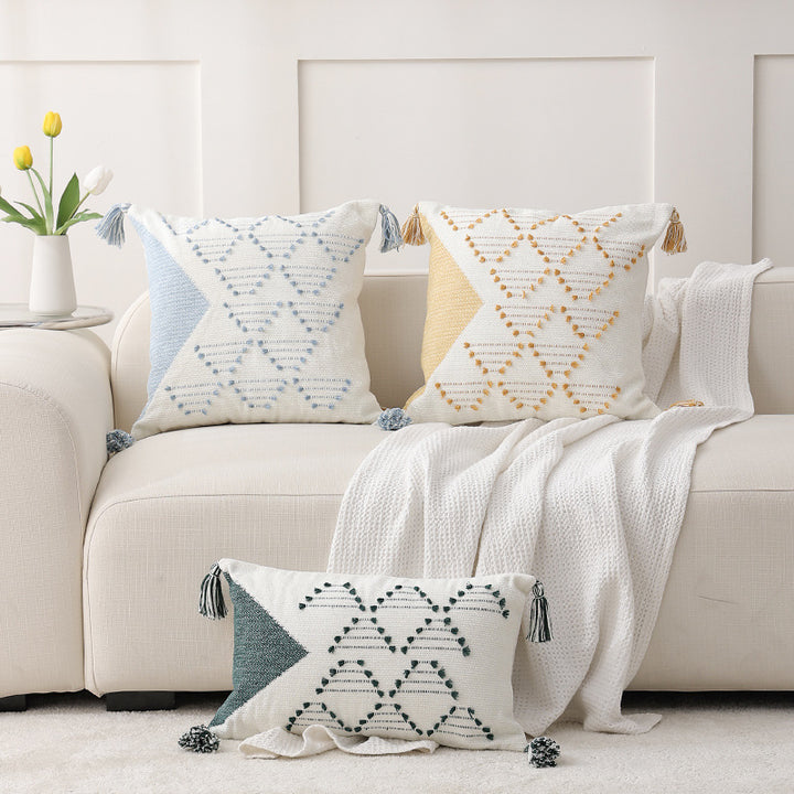 Decorative woven cushion cover with geometric tuft-relief and tassels Kalsten