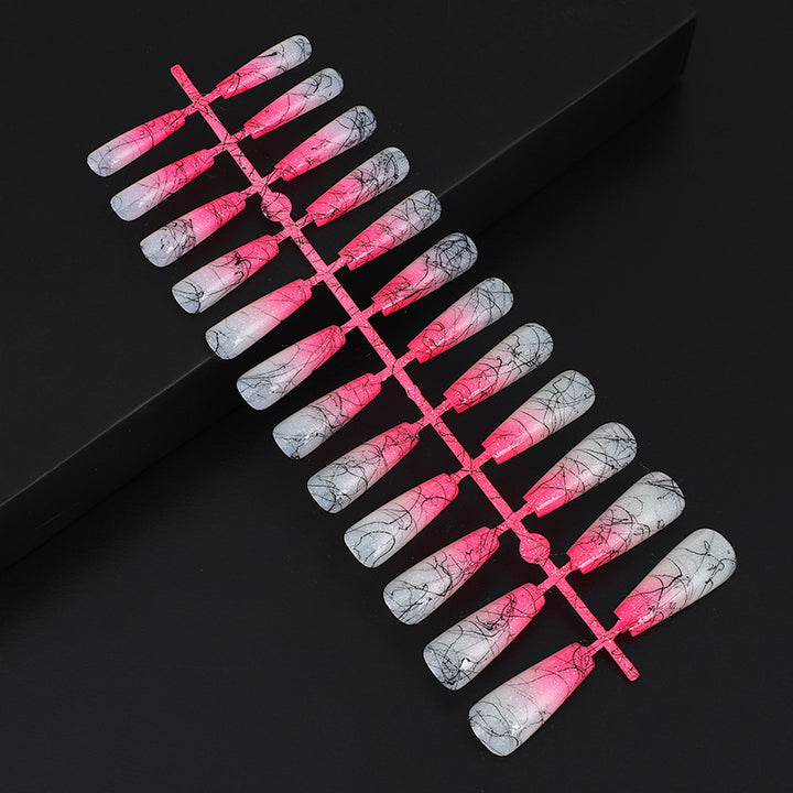 Artificial nails in modern ombre design with marbled accents Kalsten