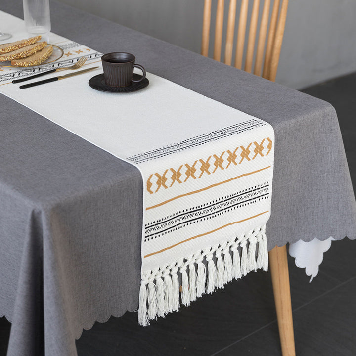 Woven Boho table runner made of cotton blend with decorative fringes and graphic stripe pattern Kalsten