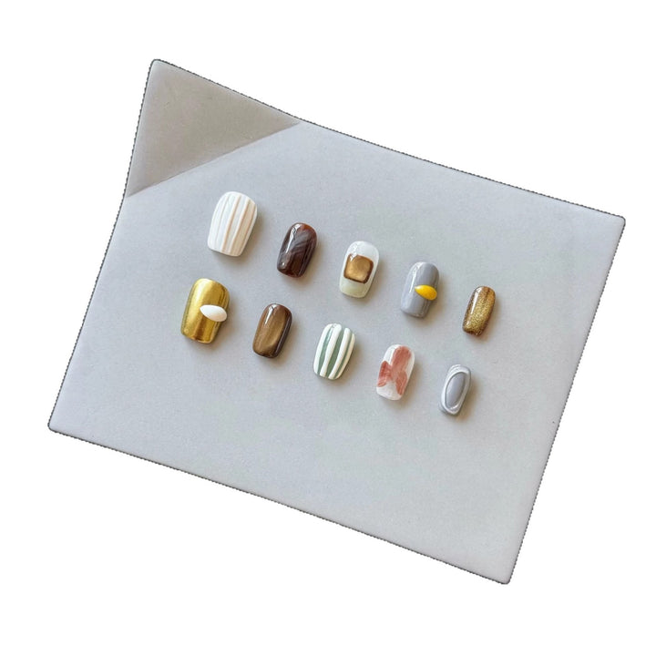 Artistic Press-On Nail Set with Unique Textured Designs