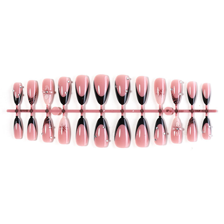 Acrylic nail set with elegant glitter and flower accents Kalsten
