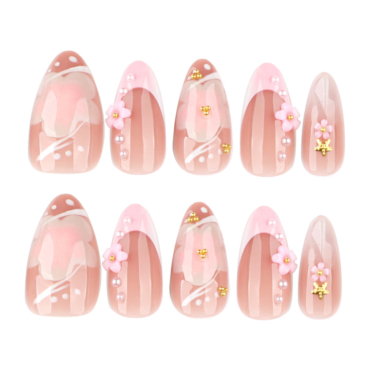 Artful nail extensions with floral patterns and glitter accents Kalsten