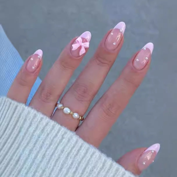 Artificial nail set with shimmering 3D bows and elegant pearl accents Kalsten