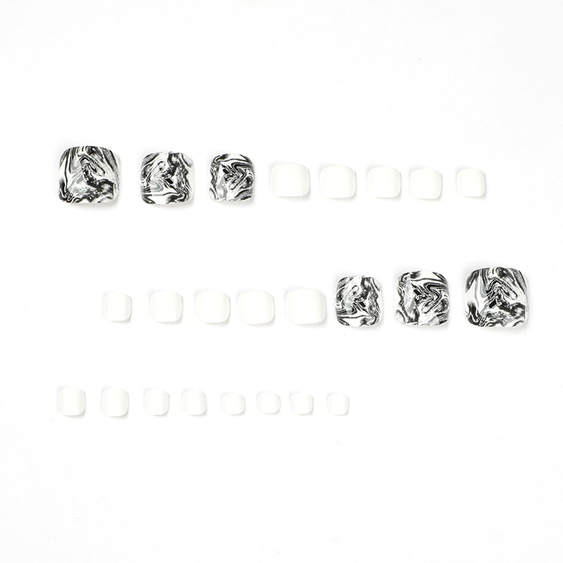 Artful toenail art in elegant marble design Kalsten