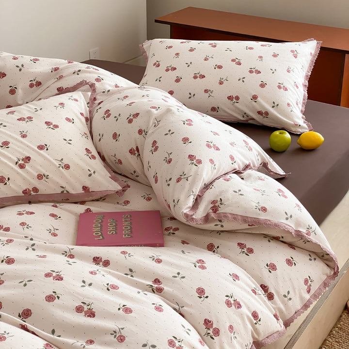 Finely woven cotton percale bedding set with delicate floral print and crocheted lace edge
