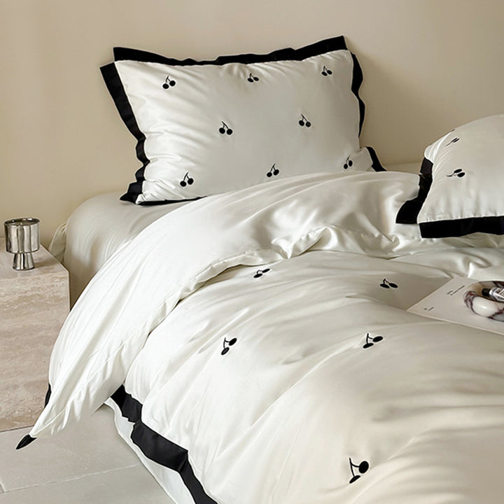 Luxurious satin bedding set with cherry embroidery and contrasting trim