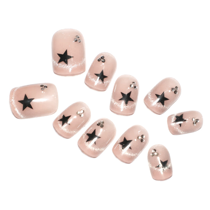 Artistic acrylic nails with glamorous star motifs Kalsten