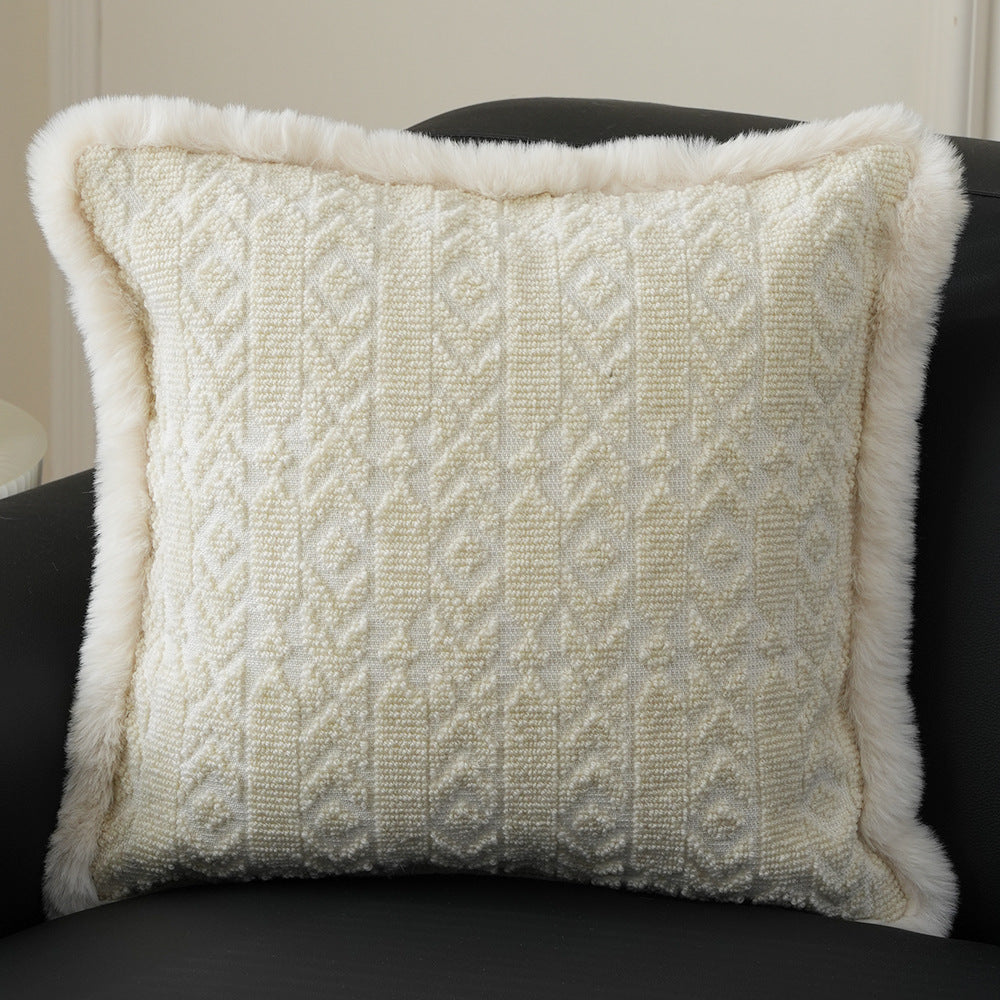 Square decorative pillow with embossed circular relief and soft faux fur edging