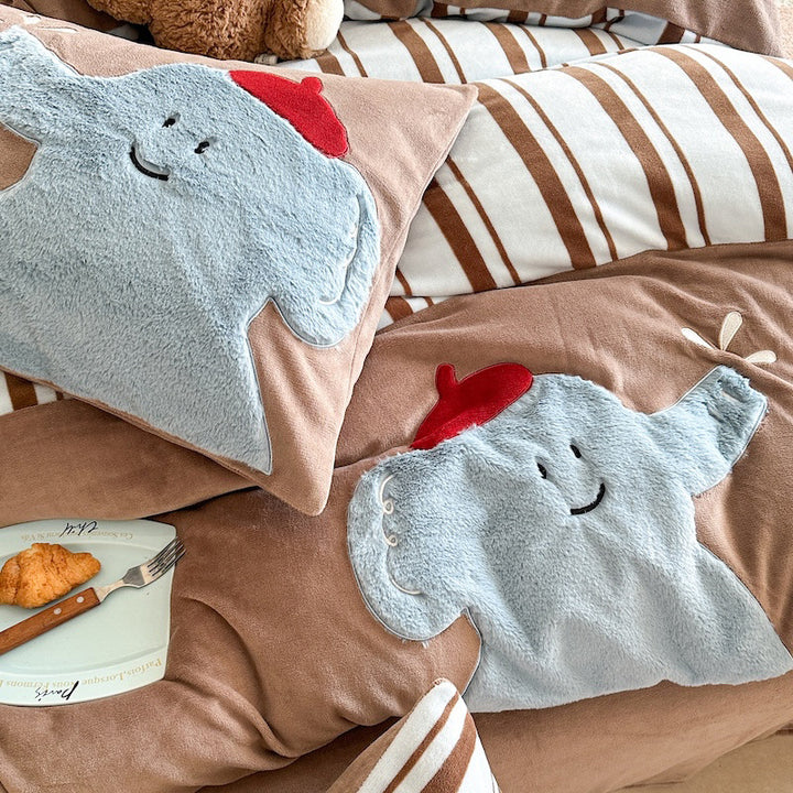 Quilted bedding and throw blanket set with check stitching, velvet texture, and floral appliqué