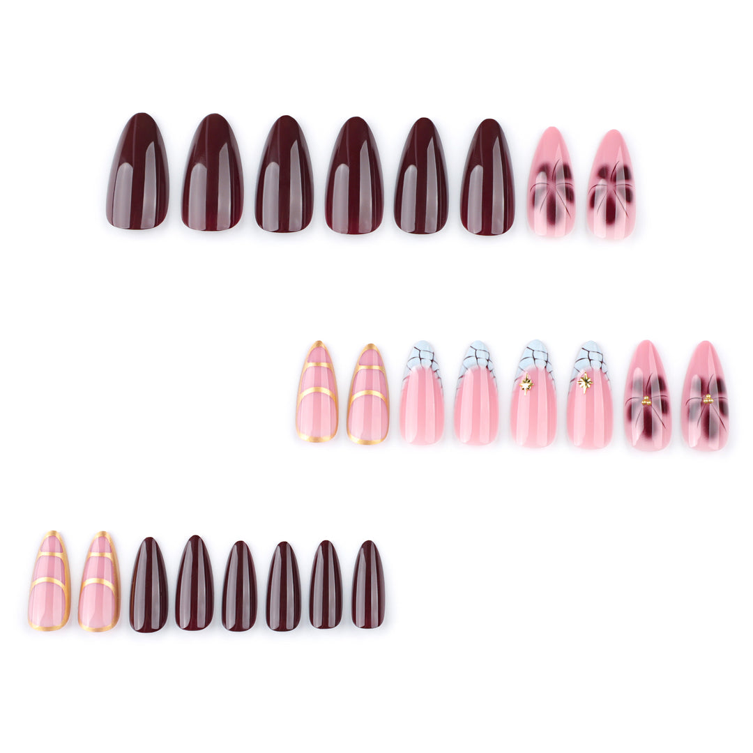 Artful Stiletto nails with gold accents and decorative floral designs Kalsten