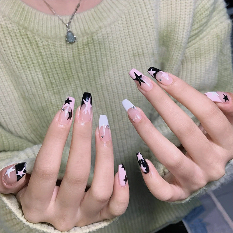 Artificial nail set with glamorous star design and sparkling accents Kalsten