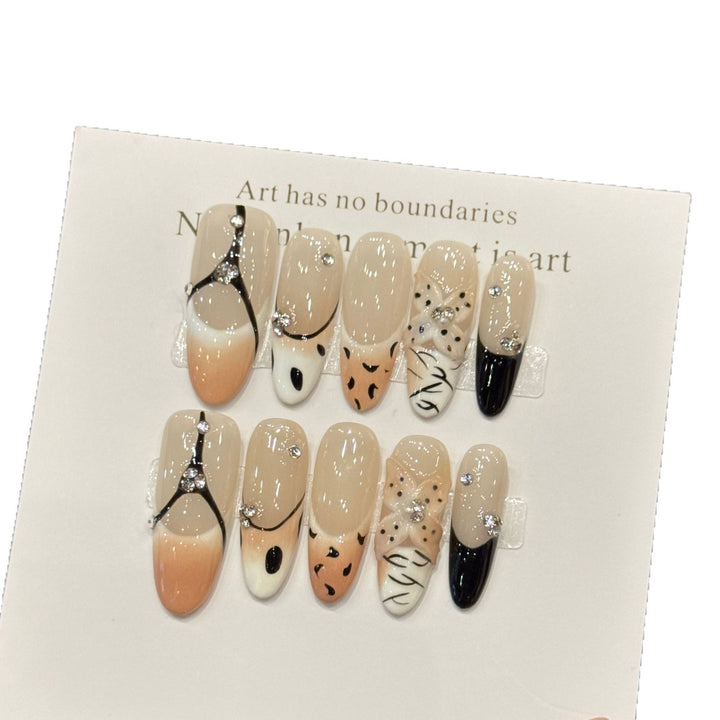 Artistic Press-On Nail Art Set with Unique Patterns and Gem Accents