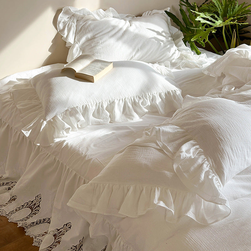 Romantic bedding set with voluminous ruffle, lace bed skirt, and double-layered frills
