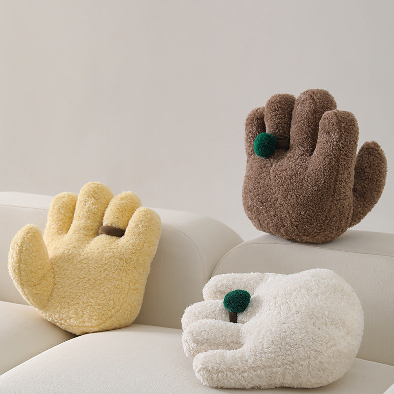 Plush decorative pillow in hand shape with pompon application Kalsten