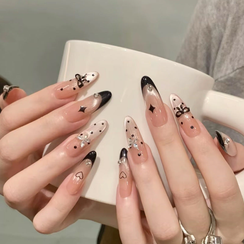 Nail art set with elegant black and white design and sparkling applications Kalsten