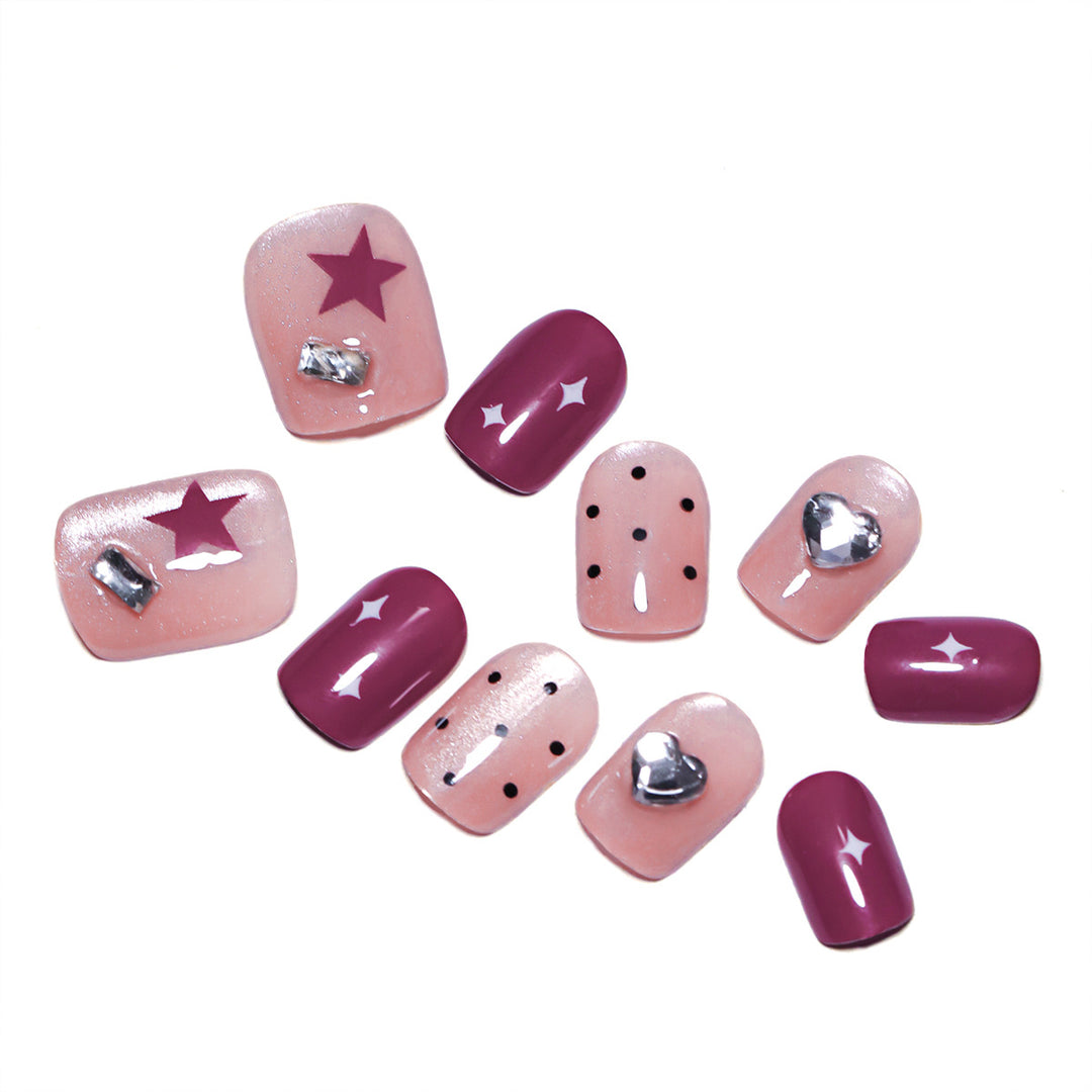 Artificial nail extensions with unique jewelry accents Kalsten