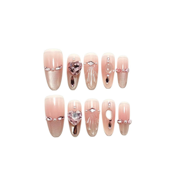 Artificial nails with sparkling heart and rhinestone accents Kalsten