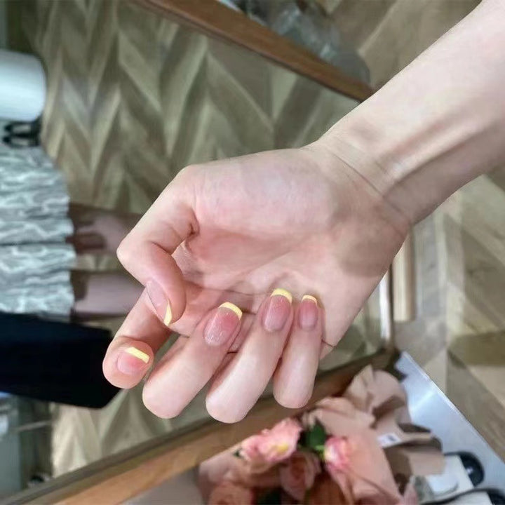 Elegant French Tip Press-On Nails with Unique Finish