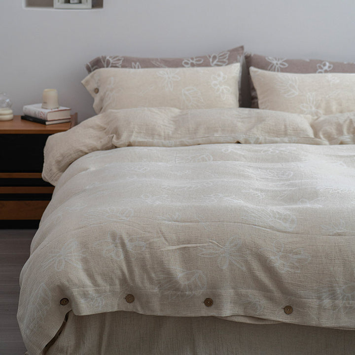 Linen look bedding set with floral print and wooden button closure